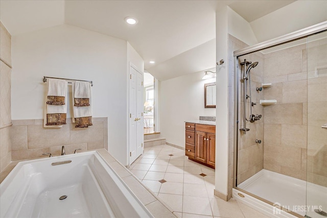 full bath with vanity, lofted ceiling, tile patterned flooring, a shower stall, and a bath