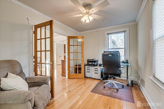 home office featuring baseboards, light wood finished floors, ceiling fan, ornamental molding, and french doors