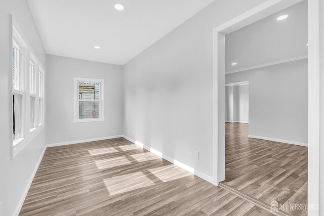 211 S Washington Ave, Dunellen, NJ 08812 - spare room featuring wood finished floors, baseboards, and recessed lighting