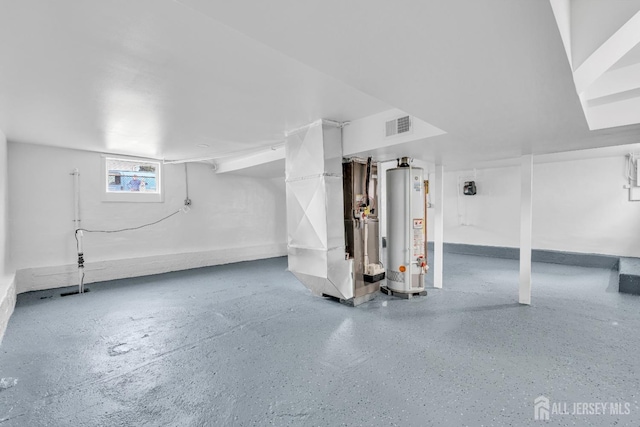 below grade area featuring water heater and heating unit