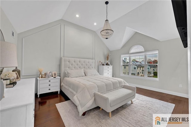 bedroom with dark hardwood / wood-style floors and vaulted ceiling