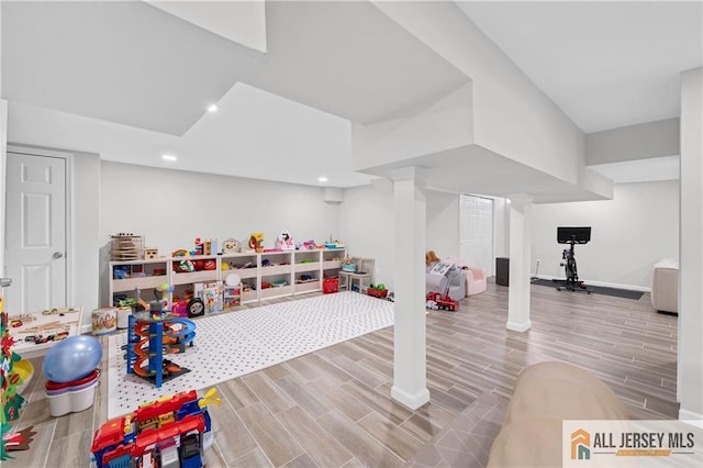 recreation room with wood-type flooring