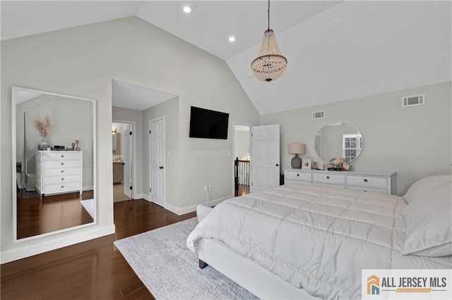 bedroom with dark hardwood / wood-style flooring and high vaulted ceiling