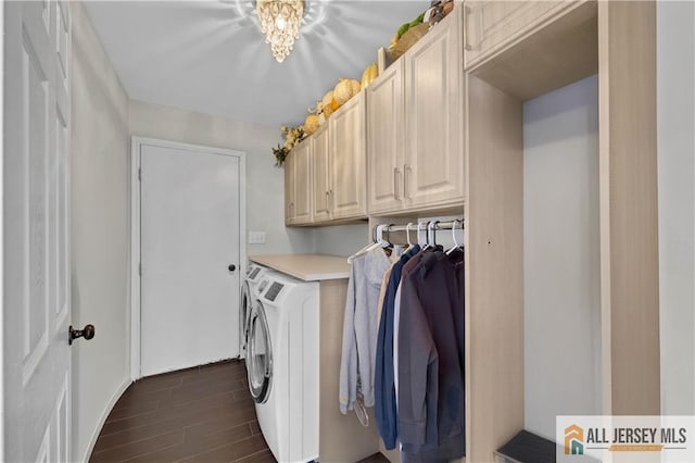 clothes washing area with dark hardwood / wood-style floors, cabinets, and washing machine and clothes dryer