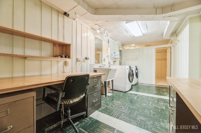 home office with washing machine and dryer and sink