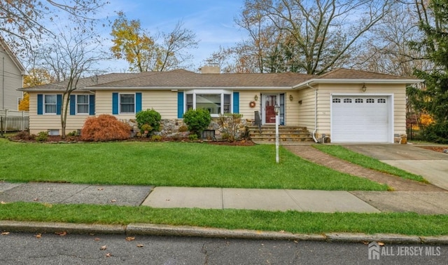 ranch-style home with a front yard and a garage