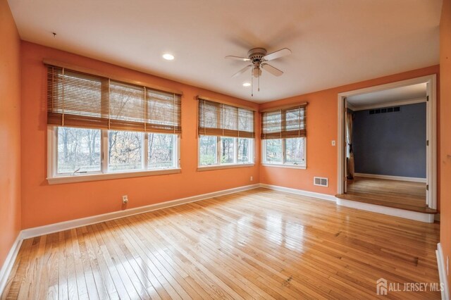 unfurnished room with light hardwood / wood-style flooring and ceiling fan