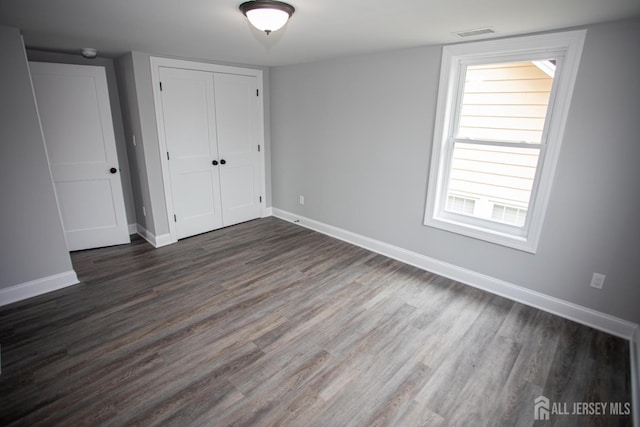 20 Prentice Ave, South River, NJ 08882 - unfurnished bedroom with dark wood finished floors and a closet