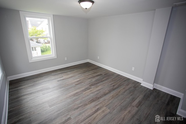 20 Prentice Ave, South River, NJ 08882 - spare room featuring dark wood-type flooring and baseboards