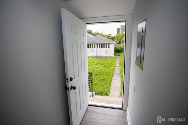 20 Prentice Ave, South River, NJ 08882 - doorway to outside featuring wood finished floors, lofted ceiling, and electric panel