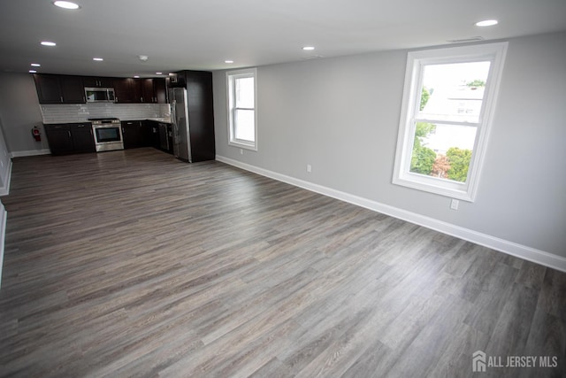 20 Prentice Ave, South River, NJ 08882 - unfurnished living room with recessed lighting and dark wood-style flooring