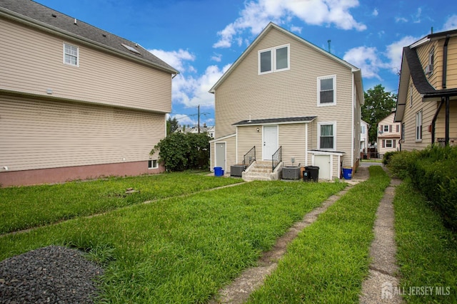 20 Prentice Ave, South River, NJ 08882 - rear view of property with entry steps and a lawn