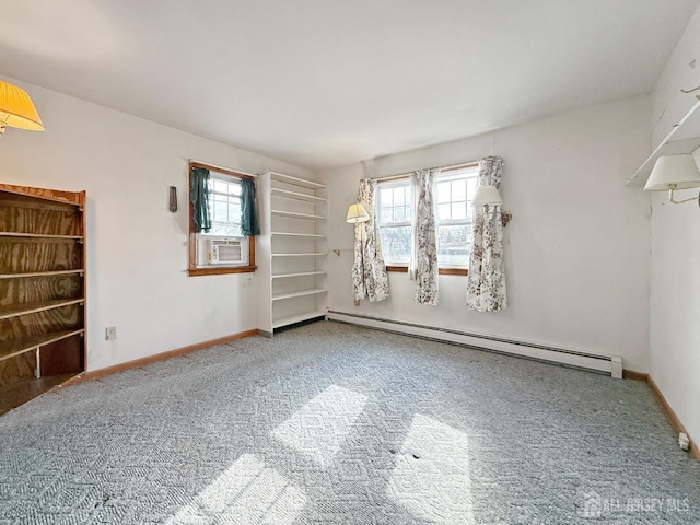 carpeted empty room featuring a healthy amount of sunlight, baseboards, and a baseboard radiator