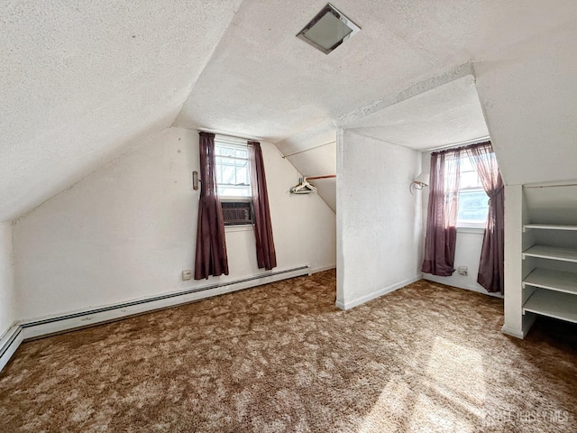 bonus room with a textured ceiling, vaulted ceiling, baseboard heating, and carpet floors