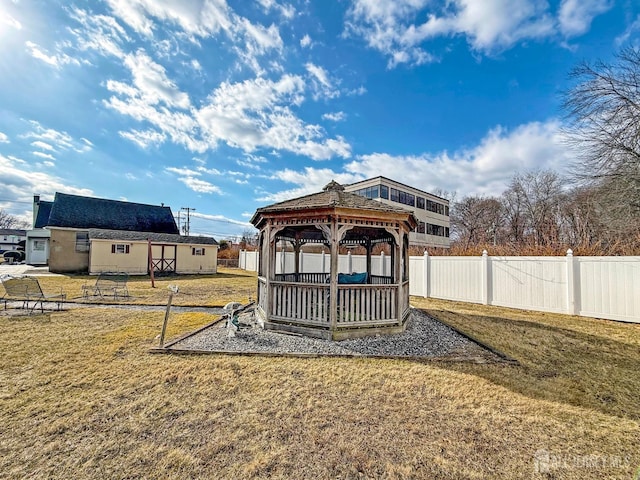 view of yard featuring fence and a gazebo