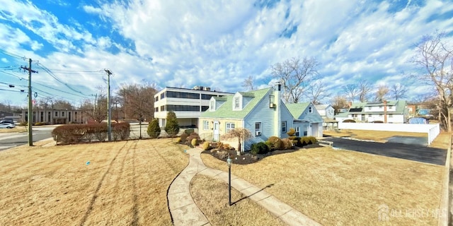 view of side of home featuring a chimney