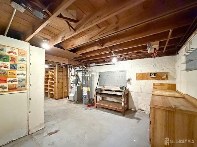 unfinished basement with a heating unit and water heater