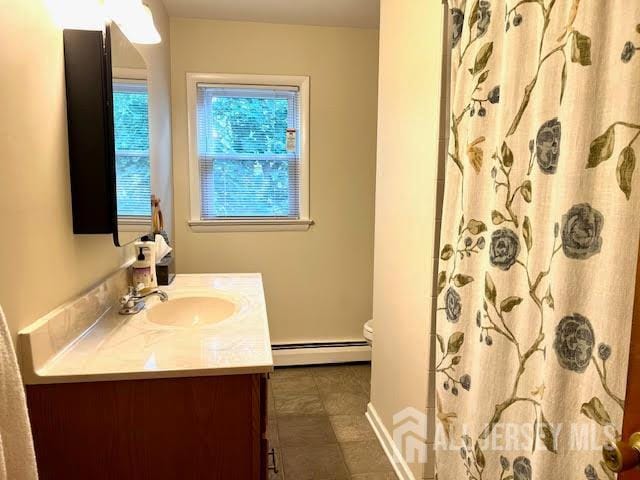 45 Browning Ave, Ewing, NJ 08638 - full bath featuring a baseboard radiator, vanity, and curtained shower