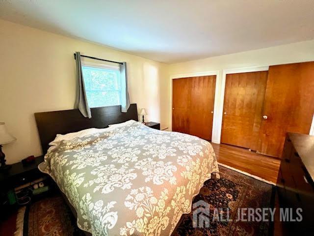 45 Browning Ave, Ewing, NJ 08638 - bedroom featuring wood finished floors and two closets