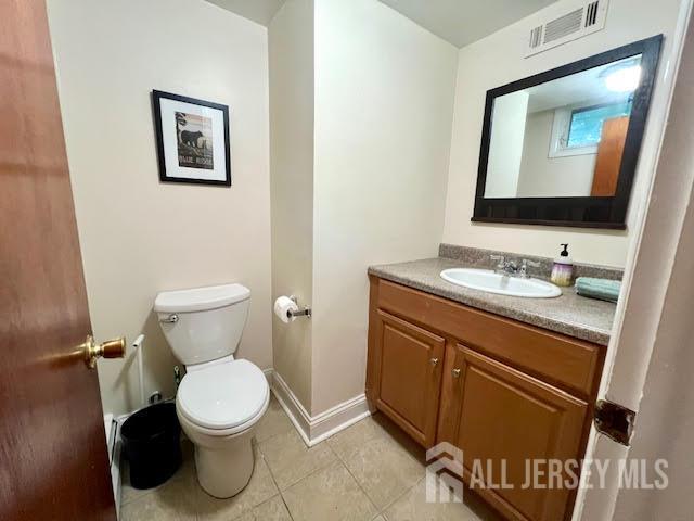 45 Browning Ave, Ewing, NJ 08638 - half bath featuring vanity and tile patterned floors