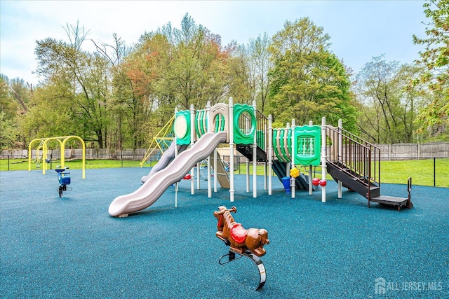 13 Carriage Pl, Edison, NJ 08820 - community jungle gym with fence and view of wooded area
