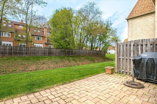 view of patio / terrace featuring fence, a residential view, and a grill