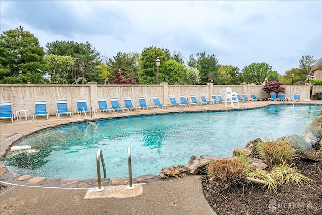 pool featuring fence