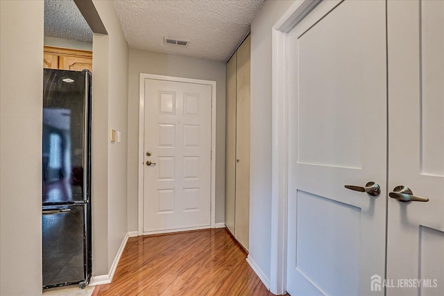 13 Carriage Pl, Edison, NJ 08820 - hallway featuring light wood finished floors, baseboards, and a textured ceiling
