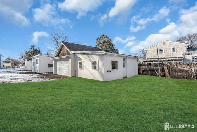 221 E Golf Ave, South Plainfield, NJ 07080 - rear view of house with an outdoor structure and stucco siding