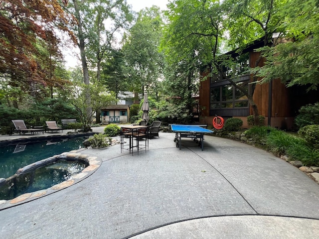 2 Gloucester Ct, East Brunswick, NJ 08816 - view of pool featuring a patio area, an outbuilding, outdoor dining area, and a pool with connected hot tub