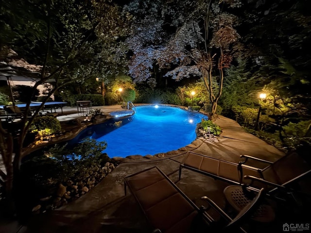 2 Gloucester Ct, East Brunswick, NJ 08816 - pool at night with a patio and an outdoor pool
