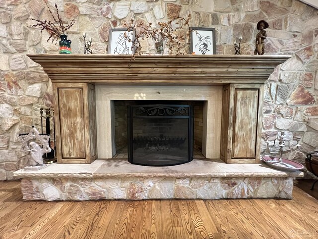 2 Gloucester Ct, East Brunswick, NJ 08816 - details with a fireplace with raised hearth and wood finished floors