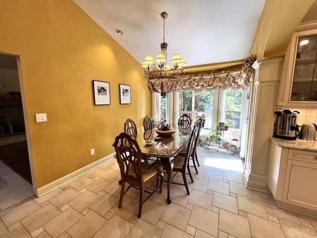 2 Gloucester Ct, East Brunswick, NJ 08816 - dining space with baseboards, a chandelier, high vaulted ceiling, and stone tile flooring