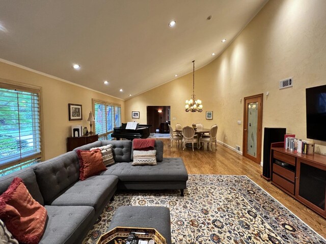 2 Gloucester Ct, East Brunswick, NJ 08816 - living room featuring an inviting chandelier, visible vents, wood finished floors, and a healthy amount of sunlight