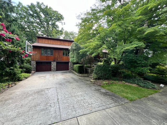 2 Gloucester Ct, East Brunswick, NJ 08816 - chalet / cabin featuring stone siding, driveway, and a garage