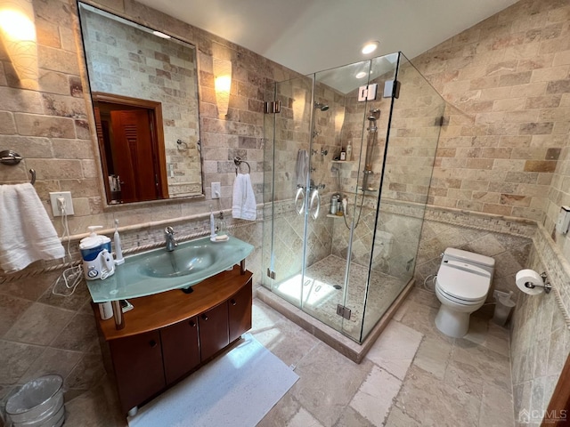 2 Gloucester Ct, East Brunswick, NJ 08816 - bathroom featuring tile walls, stone tile flooring, toilet, a shower stall, and vanity