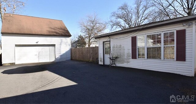 view of side of home featuring a garage