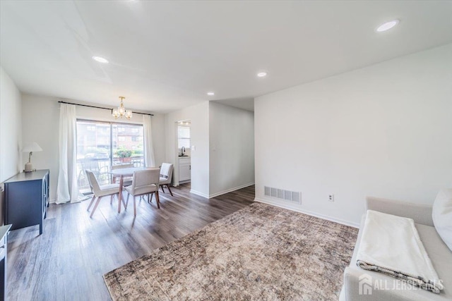 111 Beverly Hill Ter Unit A, Woodbridge Proper, NJ 07095 - dining room with a chandelier, wood finished floors, baseboards, and recessed lighting