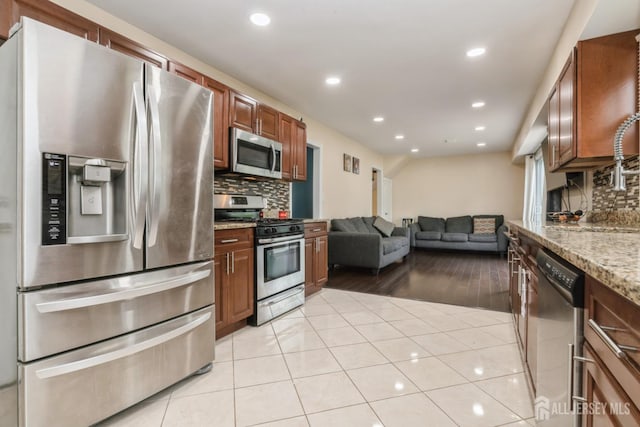 1 Webster Rd, Franklin, NJ 08873 - kitchen with stainless steel appliances, backsplash, open floor plan, recessed lighting, and light stone countertops