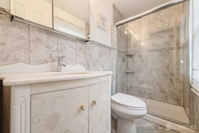 1 Webster Rd, Franklin, NJ 08873 - full bathroom with toilet, vanity, a stall shower, and tile walls