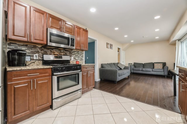 1 Webster Rd, Franklin, NJ 08873 - kitchen featuring stainless steel appliances, tasteful backsplash, light stone counters, recessed lighting, and light tile patterned floors