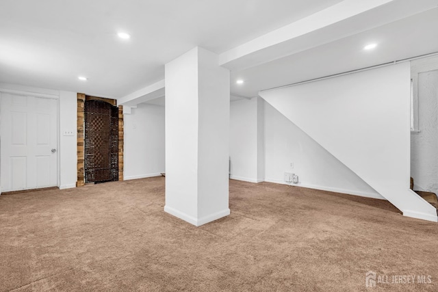 finished basement featuring carpet, recessed lighting, and baseboards