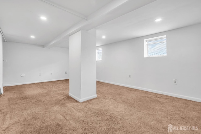 below grade area with carpet, healthy amount of natural light, recessed lighting, and baseboards