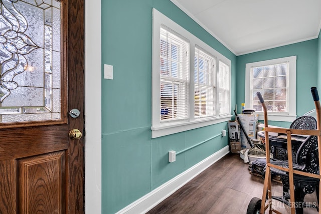 office space with crown molding, baseboards, and dark wood-type flooring