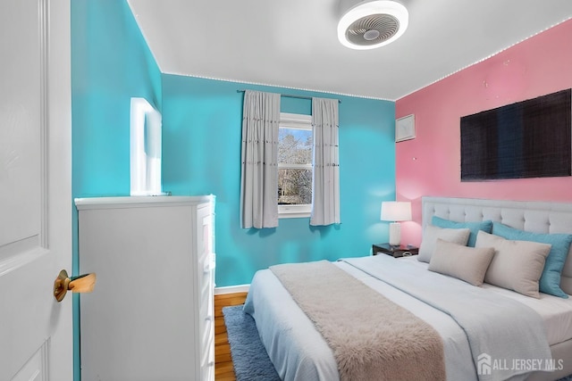 bedroom featuring wood finished floors