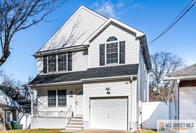 view of front of home featuring covered porch and a garage