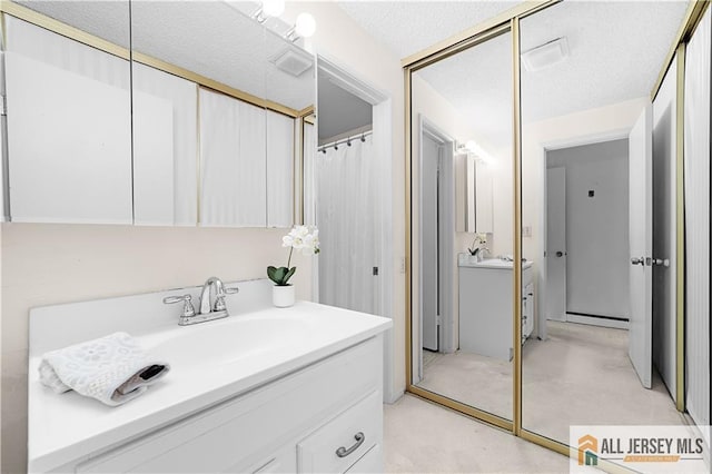 40 Haddon Rd Unit 40B, Monroe, NJ 08831 - full bath featuring vanity, a baseboard radiator, a shower with curtain, and a textured ceiling