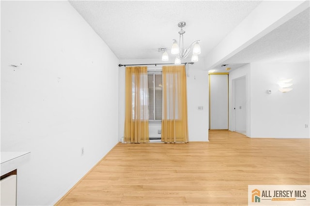40 Haddon Rd Unit 40B, Monroe, NJ 08831 - unfurnished room featuring a chandelier and light wood finished floors