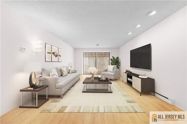 living area featuring recessed lighting, wood finished floors, baseboard heating, and a textured ceiling