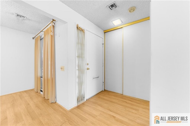 40 Haddon Rd Unit 40B, Monroe, NJ 08831 - corridor featuring a textured ceiling and wood finished floors